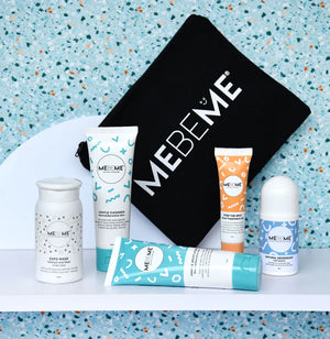 MEBEME skincare products including bottles and a roller on a white surface with a terrazzo patterned wall in the background.
