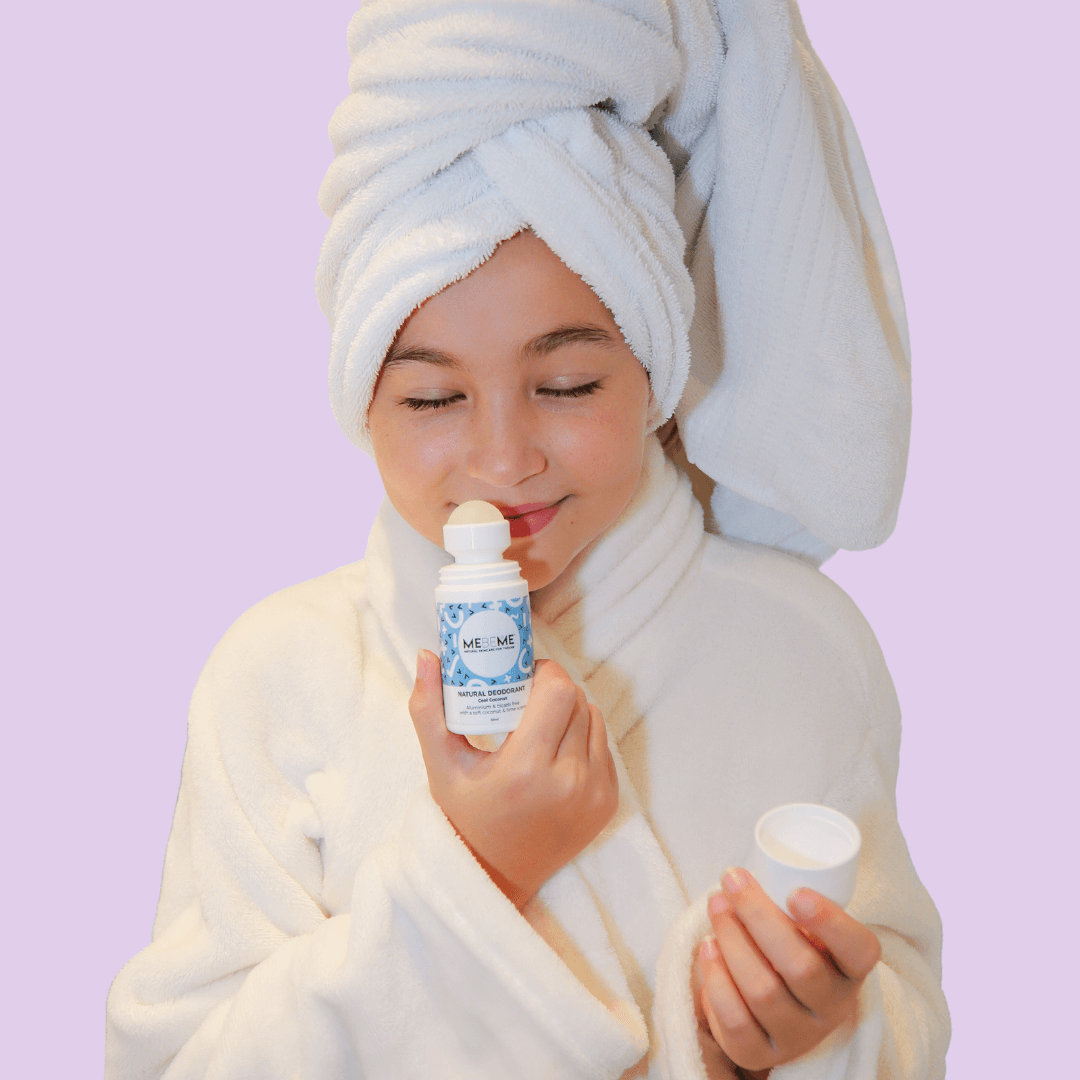 aluminium free coconut deodorant being smelled by girl in her robe