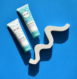 Gentle MEBEME skincare products on a blue background with a white zigzag object.
