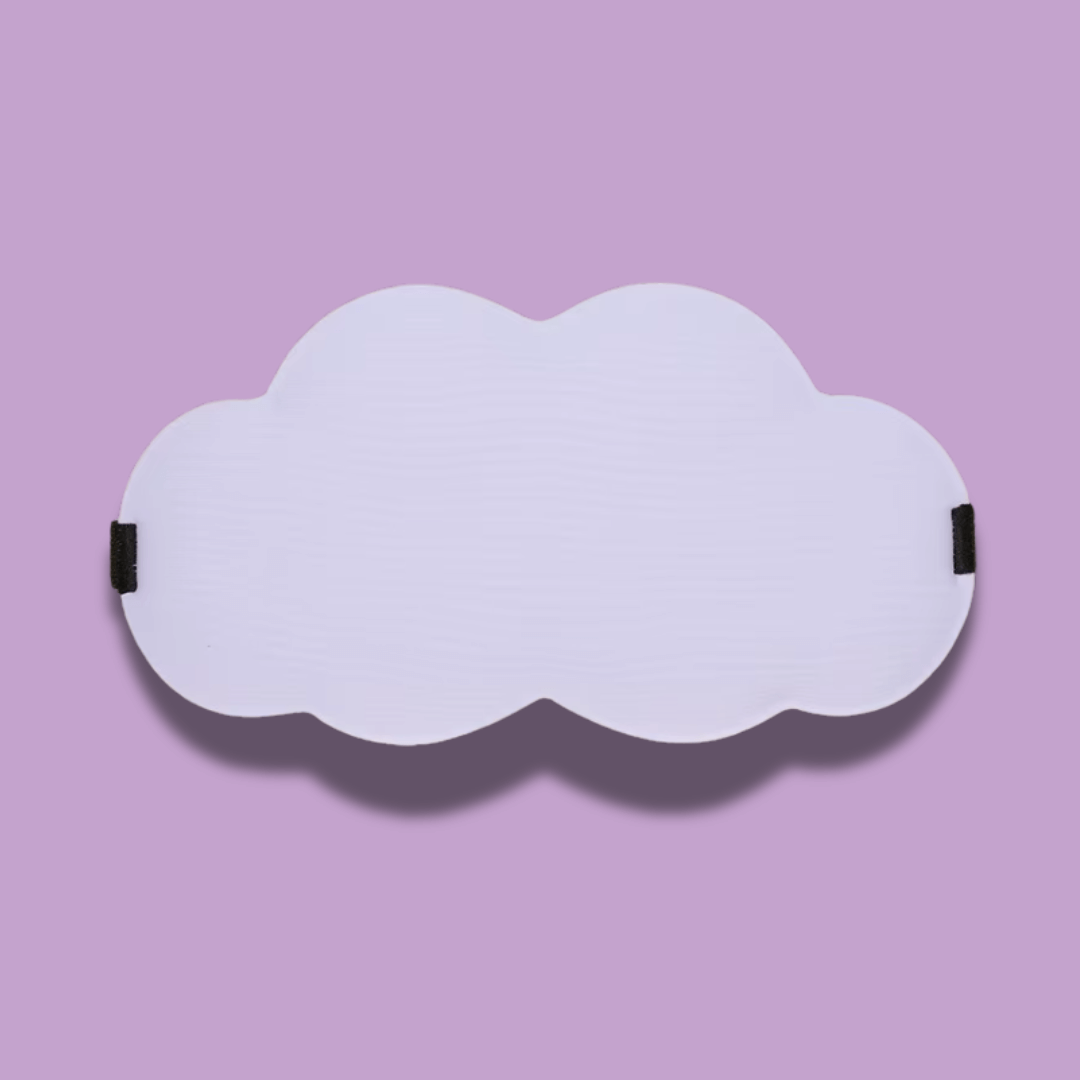 Cloud-shaped sleep mask on a lilac background