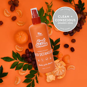 No Nasties Kids Natrual Detangler Spray on an orange background with mandarins and grapes