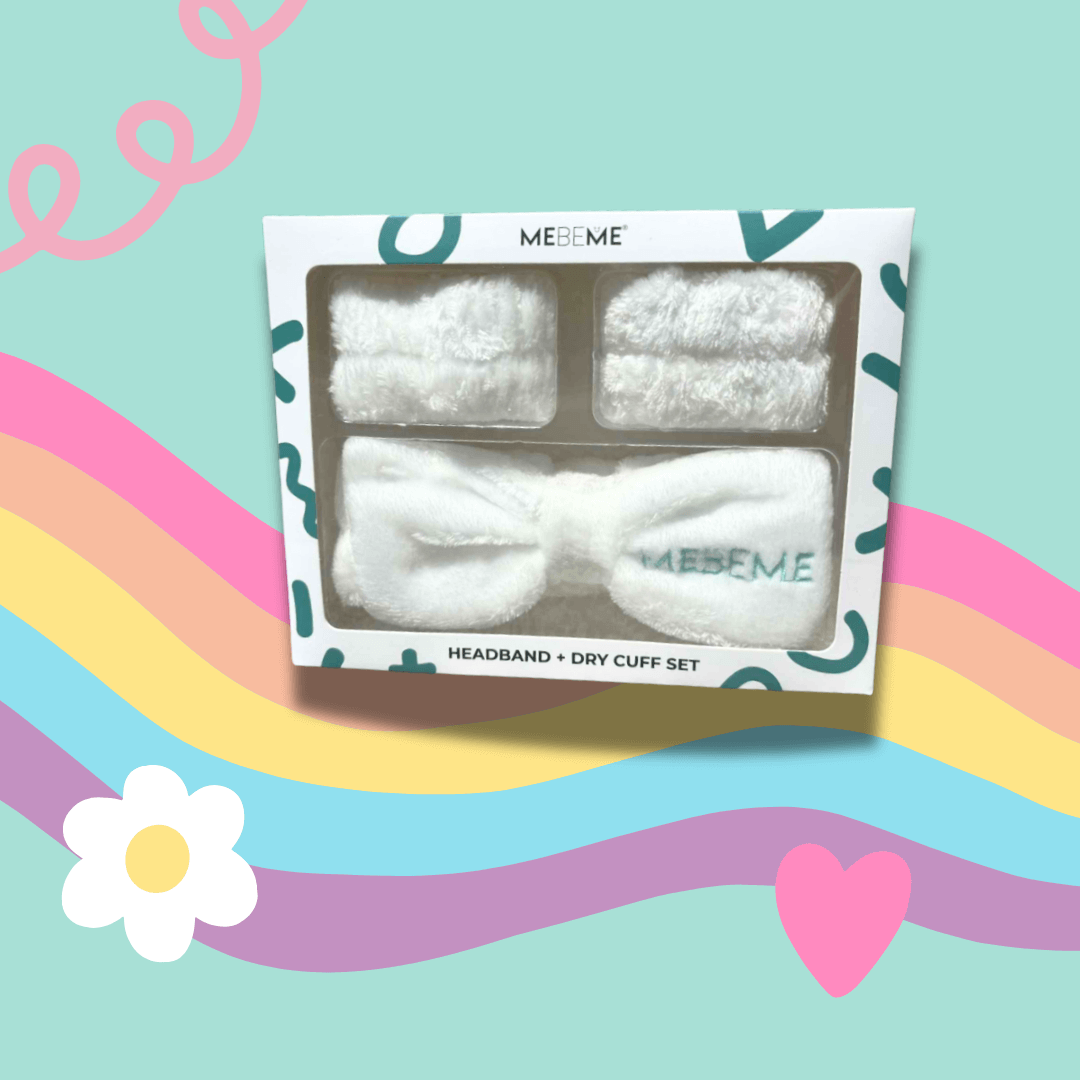 Skincare headband and dry cuff set packaging on a colourful background with rainbow, heart, and flower illustrations.