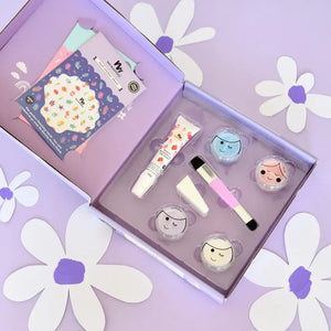 Purple kids makeup set open with contents inside showing