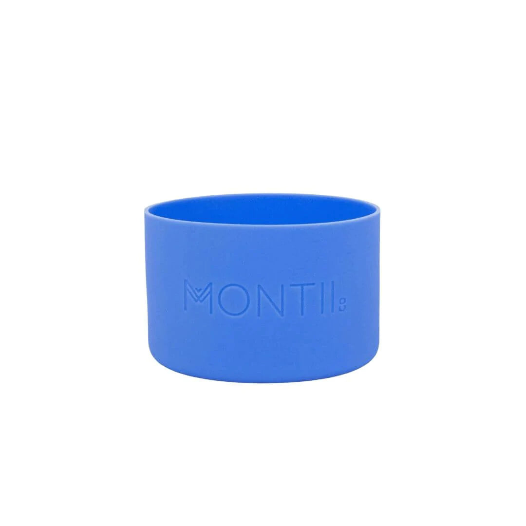 Montii drink bottle green with blue bumper held by child