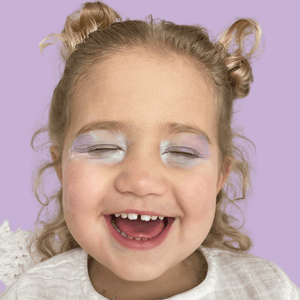 Kids-play-makeup-in-purple-on-cute-girl-laughing