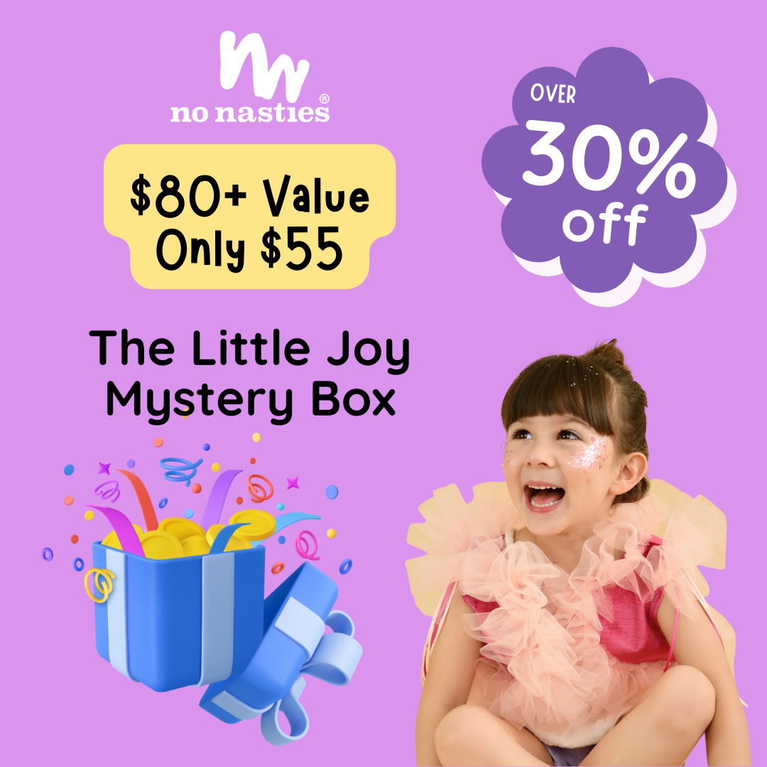 Advertisement for 'The Little Joy Mystery Box' with a child on a purple background, featuring the brand 'no nasties'.