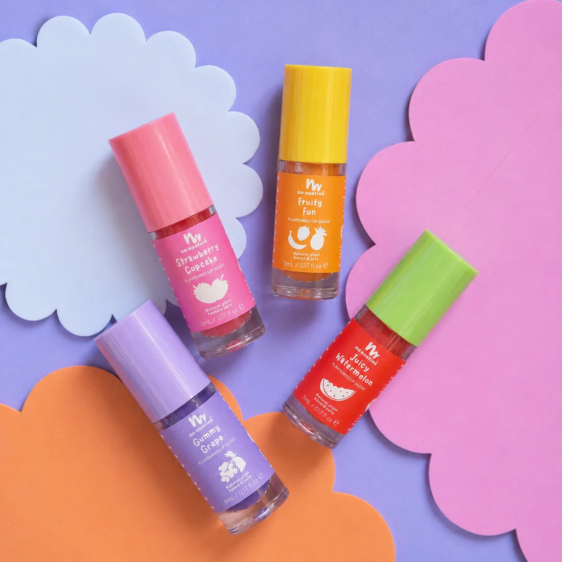 Four small lip gloss bottles with colorful caps and labels arranged on pastel paper clouds. 