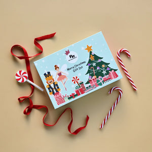 Christmas-themed makeup gift set with candy canes and ribbon on a beige background