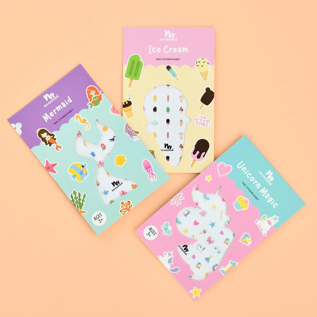 Three sticker books with mermaid, ice cream, and unicorn designs on a peach background