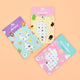 Three sticker books with mermaid, ice cream, and unicorn designs on a peach background