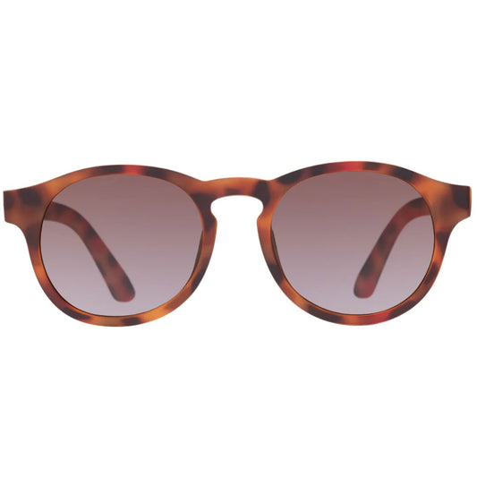 little boy wearing tortoise shell polarised sunglasses