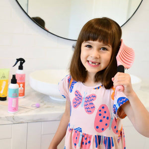 girl-using-best-detangling-brush-in-nz