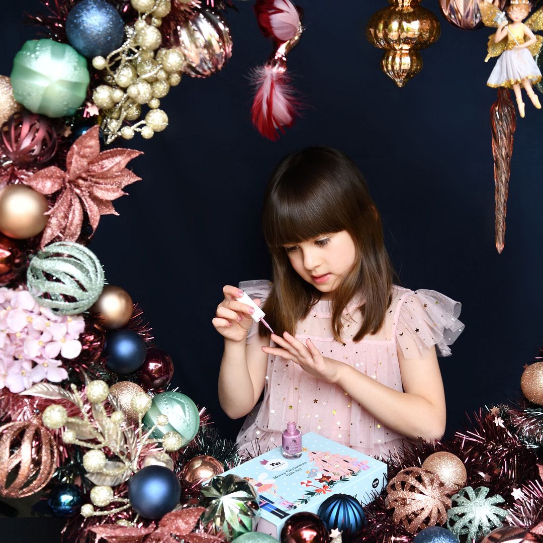 girl-applying-kids-nail-polish-and-natural-makeup