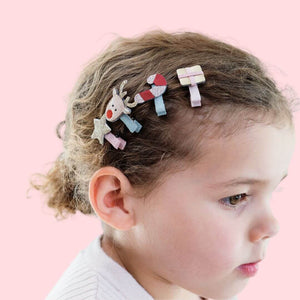 little girl wearing Christmas mini hair clips 