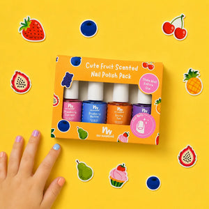 Yellow background with a childs hand in the left corner with nail polish on their nails. Fruit cutouts laid on the back ground and the Cute fruit Scented Nail Polish Pack in the center