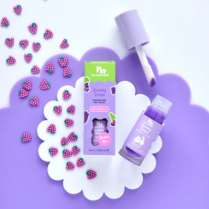 Grape lip gloss and white and purple background