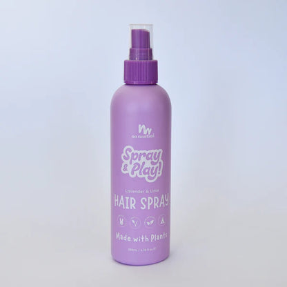 Purple hair spray bottle with 'Spray & Play' text on a light purple background