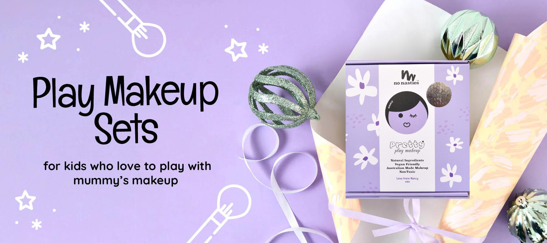kids purple makeup set with Christmas ornaments and wrapping