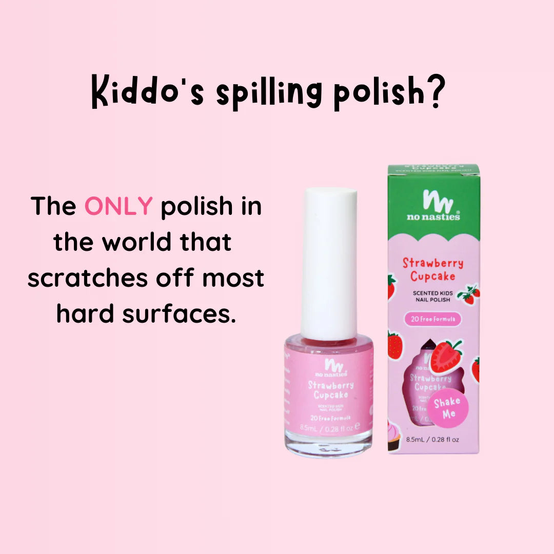 Strawberry scented kids nail polish and strawberry shaped item on a pink flower shaped background.