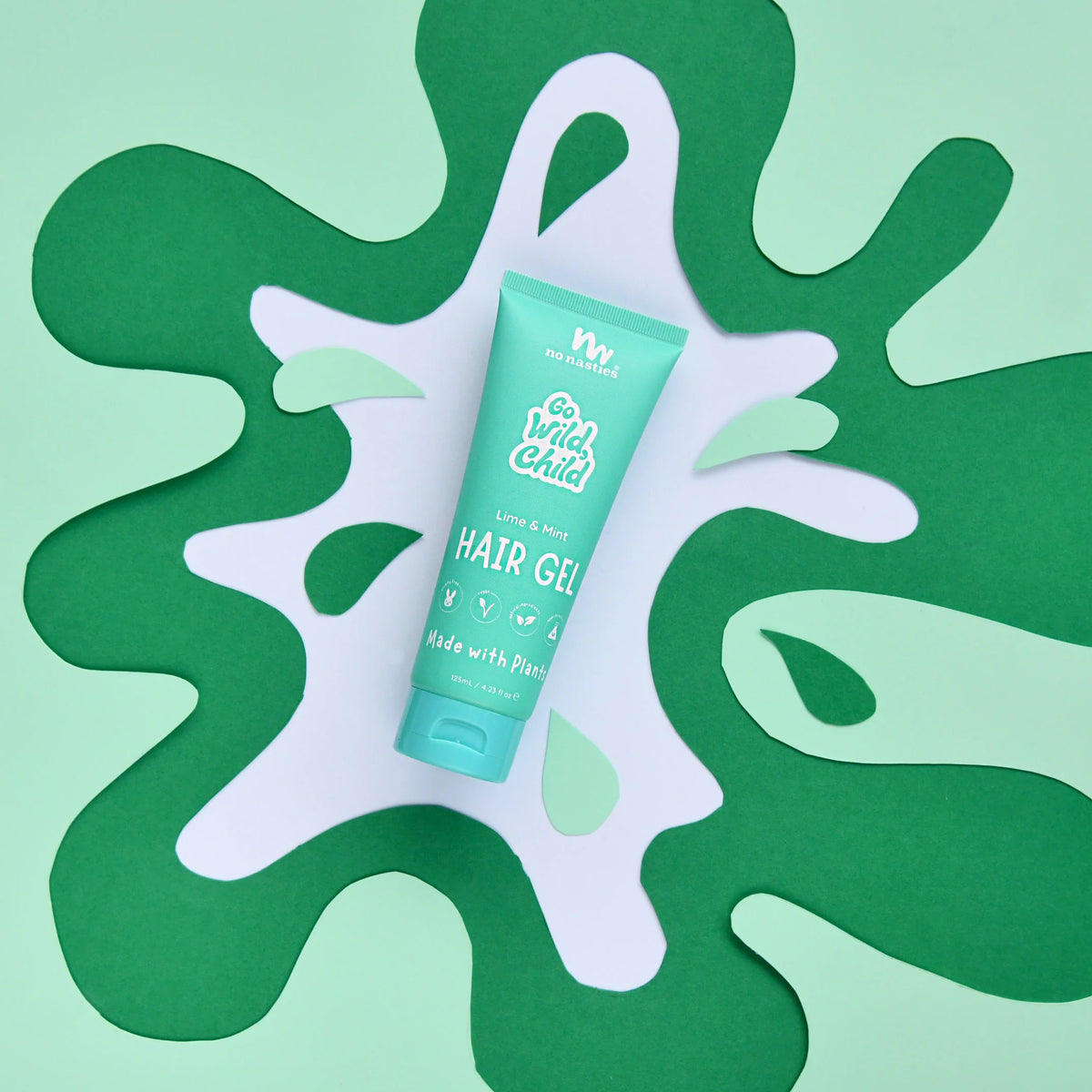 No Nasties Kids NZ green hair gel tube on a green abstract background