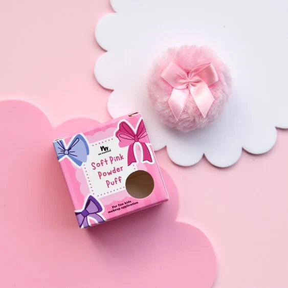 pretty pink powder puff on pink background with packaging