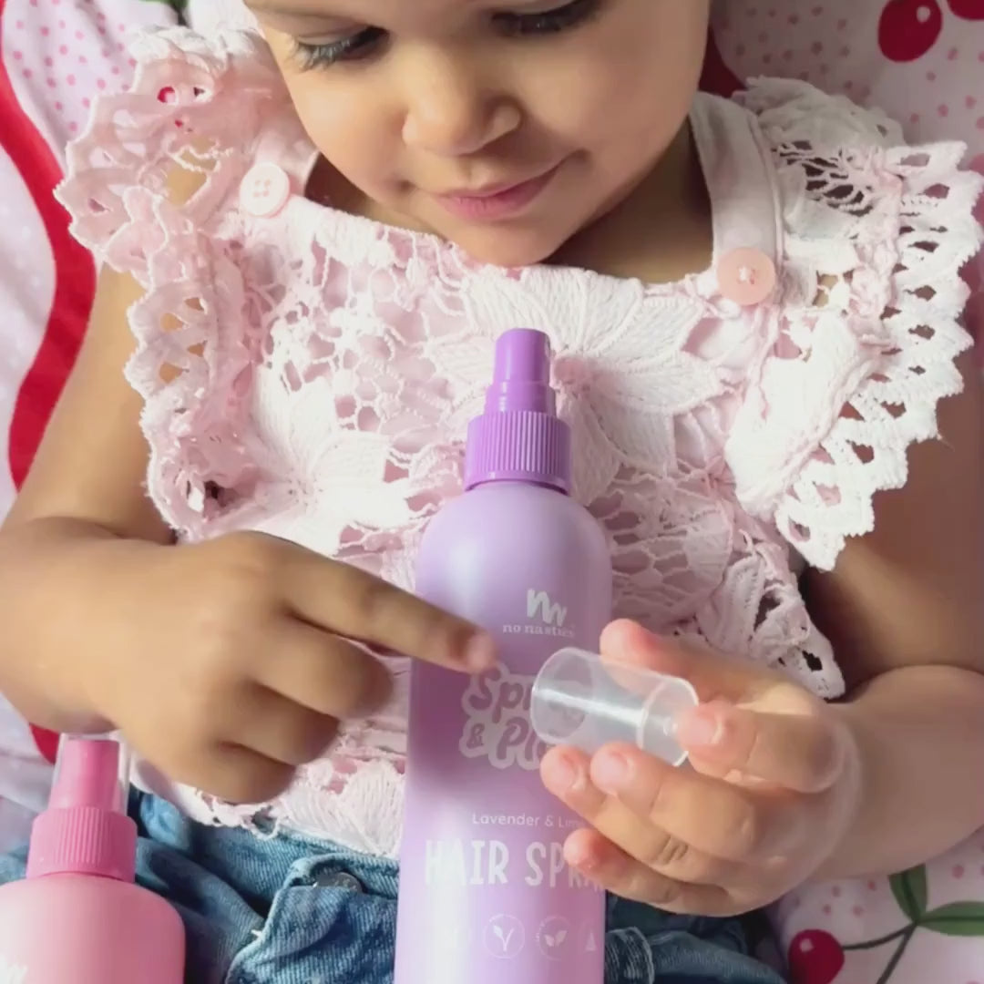 Little girl holding No Nasties Kids NZ kids hair spray