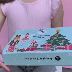 Little girl opening No Nasties Kids Christmas Makeup Set