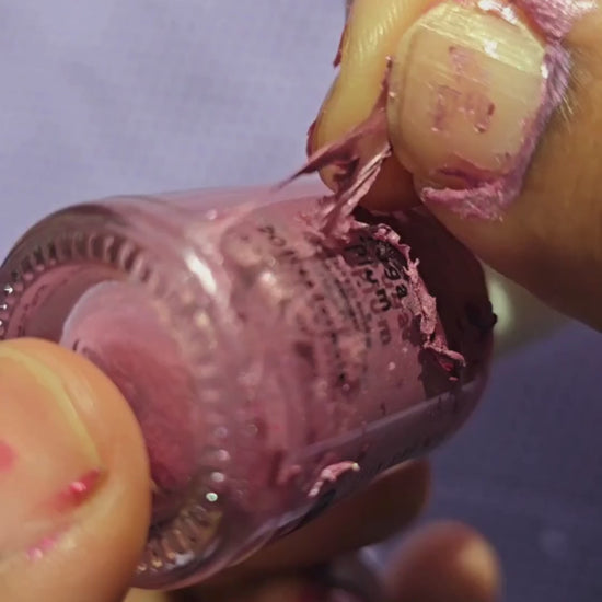 Kids peeling nail polish from the bottle