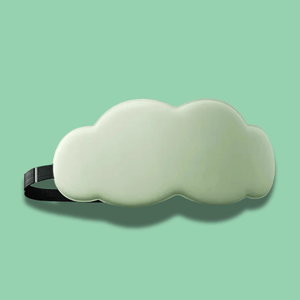 Cloud-shaped sleep mask on a solid green background