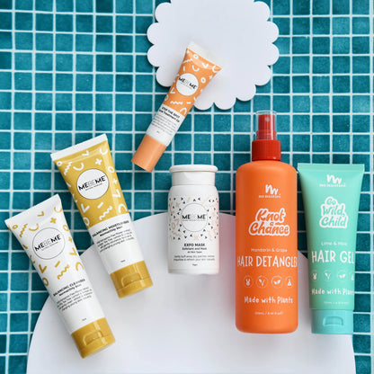Collection of teen skincare and hair care products on a blue tiled background