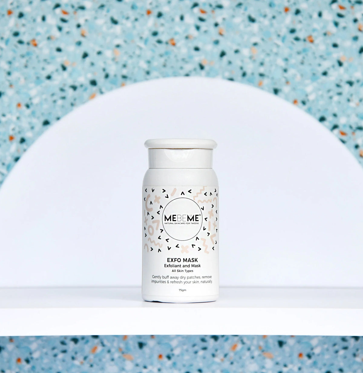 White MEBEME skincare product bottle with a patterned label on a white background