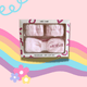 MEBEME headband and dry cuff set packaging on a colorful background with rainbow and floral elements.