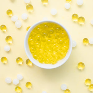 Water beads NZ yellow in white bowl