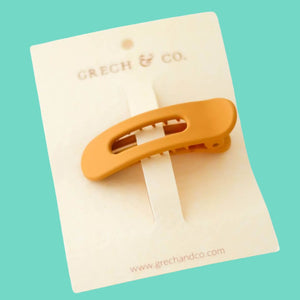 Gold hair clip by Grech & Co