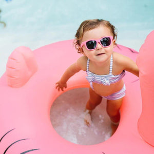 Toddler sunglasses by Babiators in the swimming pool