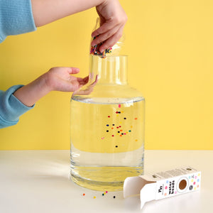 Kid playing with water beads